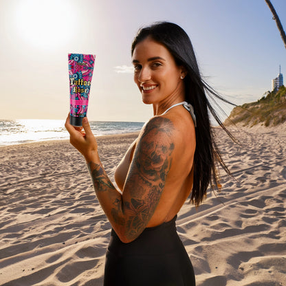 Happy woman holding Onyx Tattoo Rose tanning bronzer, ideal for sunbeds and outdoor tanning with tattoo protection